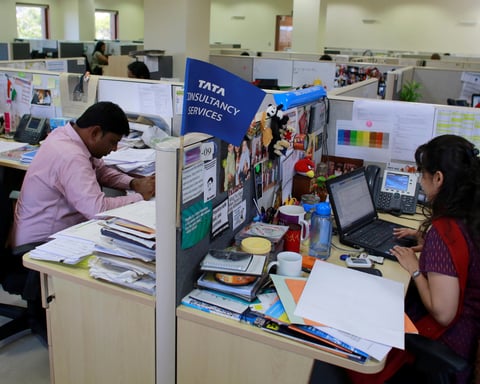 Employees work at the Tata Consultancy Services headquarters in Mumbai, India