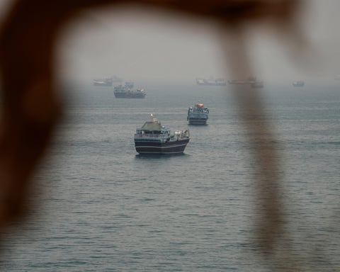 A commercial tanker burns in the Strait of Hormuz after US Navy strikes; three Indian sailors were among the dead