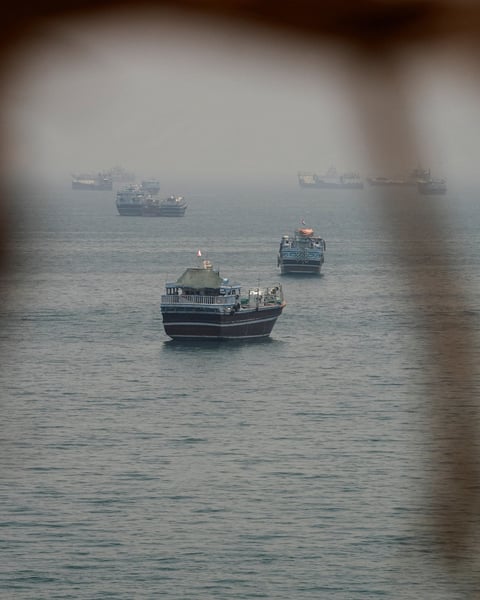 A commercial tanker burns in the Strait of Hormuz after US Navy strikes; three Indian sailors were among the dead