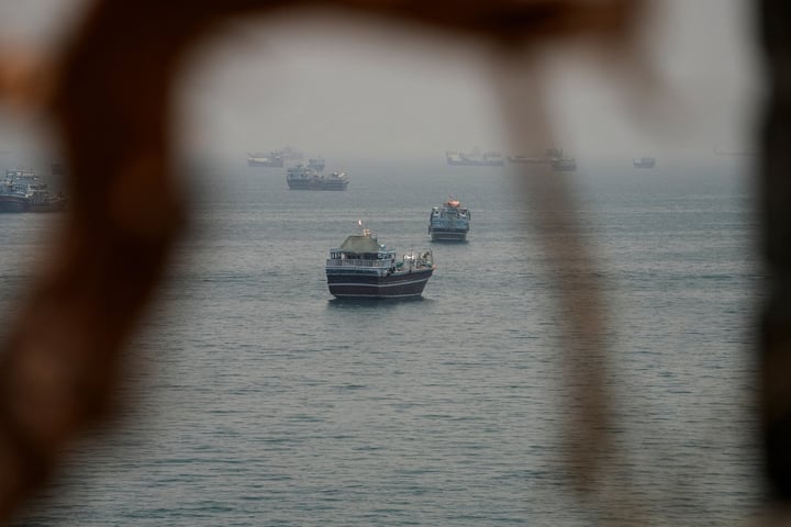 A commercial tanker burns in the Strait of Hormuz after US Navy strikes; three Indian sailors were among the dead
