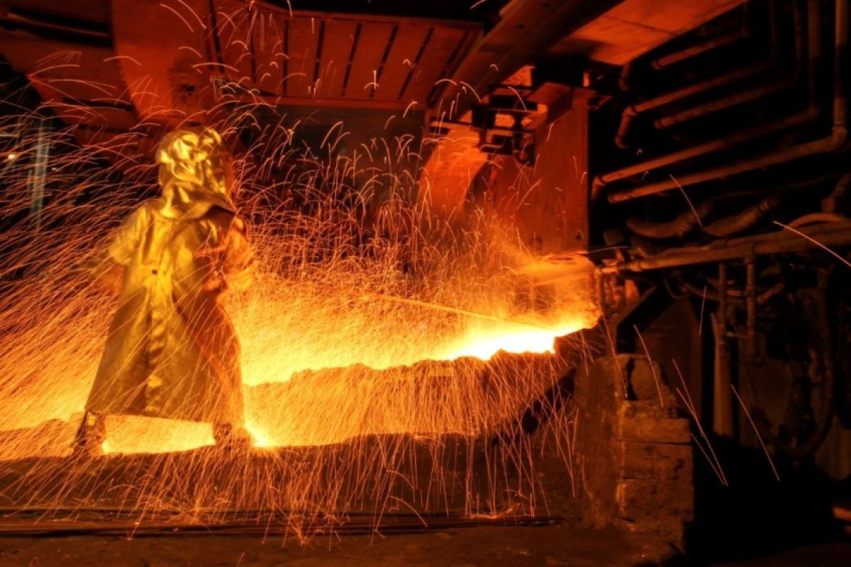 Workers and equipment at a nickel ore mine in Indonesia