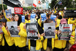University students take part in a protest against government policies in Jakarta