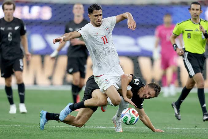 Iran and New Zealand players compete during a FIFA World Cup 2026 group-stage match at SoFi Stadium.