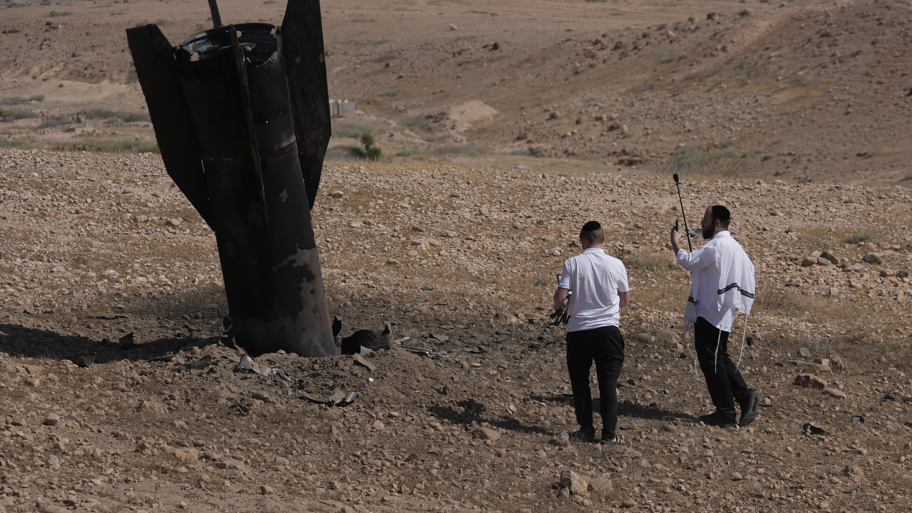 Israeli security forces examine a fragment of an intercepted Iranian missile in northern Israel on June 8 2026