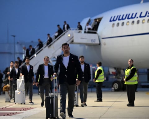 Iran national football team arrives for the 2026 World Cup wearing pins for children killed in the Minab school strike