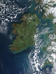 NASA MODIS Aqua satellite image of Ireland on a clear day showing the green interior landscape with Belfast on the northeast coast east of Lough Neagh Derry on the northwest and Dublin on the east coast of the Republic