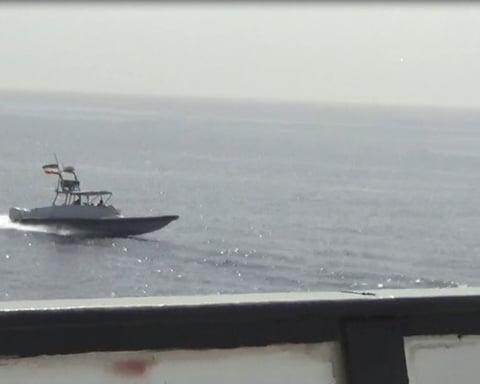 Iranian IRGC speedboat approaches US Navy vessels in the Persian Gulf