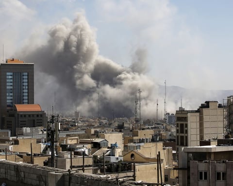 Smoke plume rising over buildings in Tehran following Israeli airstrikes on June 8 2026