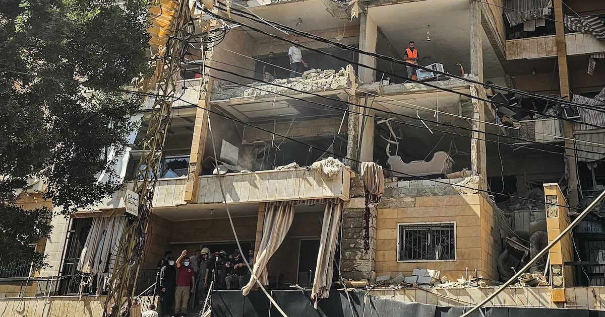 First responders inspect damage at apartment building hit by Israeli airstrike in Beirut Dahiyeh suburb June 2026