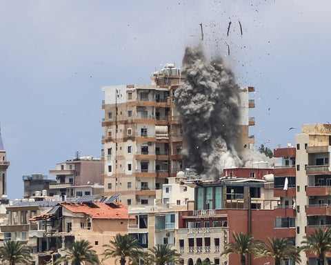 Smoke and debris rise over Tyre, southern Lebanon, after an Israeli air strike on June 9, 2026