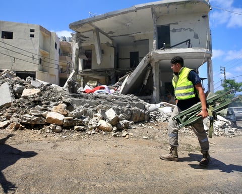 People survey damage following Israeli air strikes on Saksakiyah village in south Lebanon on June 6, 2026