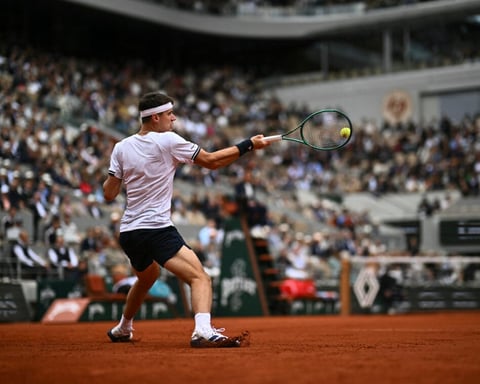 Jakub Mensik hits a forehand during his first Grand Slam semifinal at Roland Garros 2026