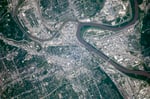 NASA astronaut photograph from the International Space Station of the Kansas City metropolitan area showing the Missouri and Kansas rivers meeting with the Kansas City Missouri urban grid on one side and Kansas City Kansas on the other