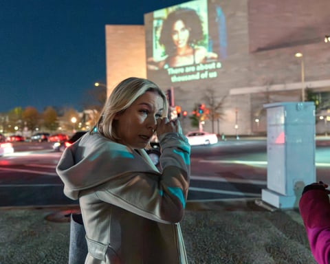 Danielle Bensky wipes a tear at a World Without Exploitation event calling on Congress to pass the Epstein files transparency act