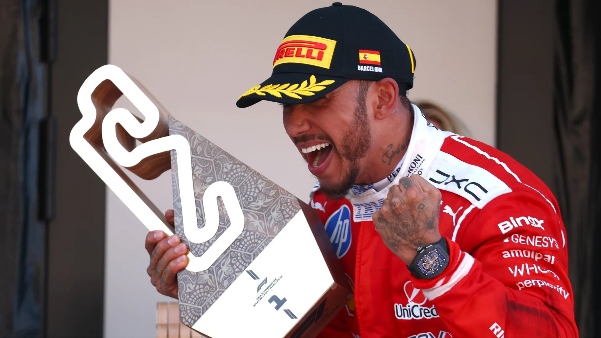 Lewis Hamilton crosses the finish line in Ferrari red at the 2026 Barcelona-Catalunya Grand Prix for his maiden Ferrari Formula One win