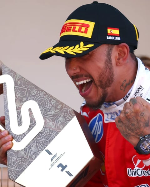 Lewis Hamilton crosses the finish line in Ferrari red at the 2026 Barcelona-Catalunya Grand Prix for his maiden Ferrari Formula One win