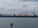 LNG carriers at anchor off Singapore, the kind of vessels that will move Malaysian gas to Japan under the new Petronas-JERA deal