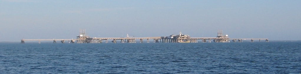 An LNG terminal with storage tanks, illustrating a liquefied natural gas story