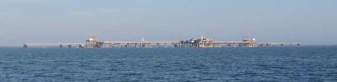 An LNG terminal with storage tanks, illustrating a liquefied natural gas story