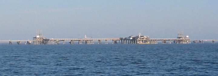 An LNG terminal with storage tanks, illustrating a liquefied natural gas story