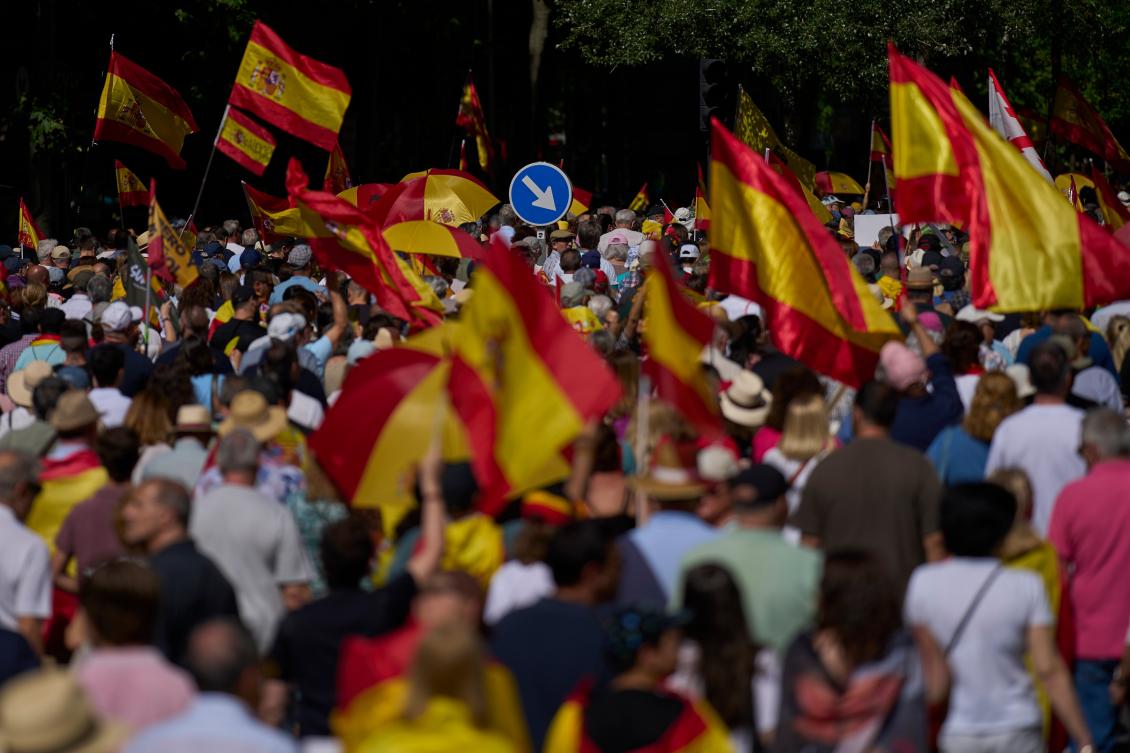 Demonstrators with Spanish flags protest against Pedro Sanchez's government in Madrid