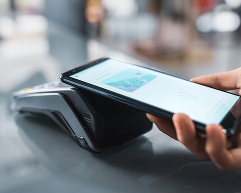 Person reviewing phone privacy settings and app permissions on a smartphone in 2026