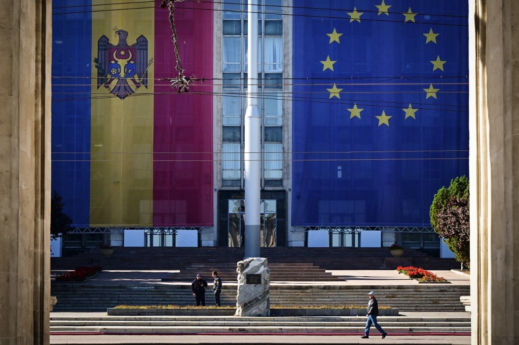 Large flags of Moldova and the European Union on government buildings in Chisinau, September 2025
