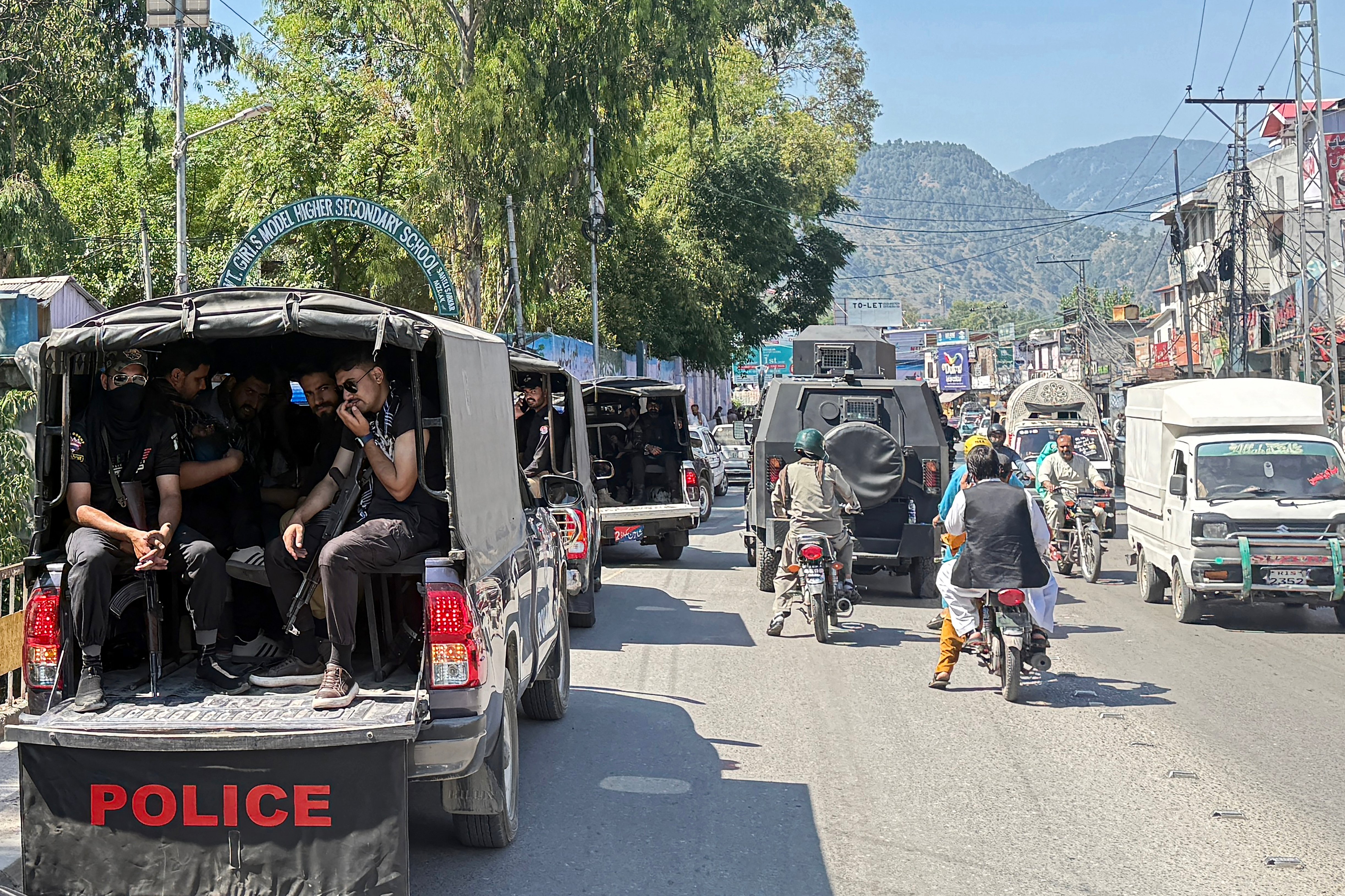 Security personnel patrol Muzaffarabad on the eve of the Joint Awami Action Committee rally, days after the group was banned under anti-terror laws