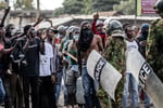 Demonstrators confront Kenyan police during the protest against the US Ebola quarantine centre in Nanyuki