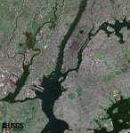 NASA Landsat 7 ETM+ satellite image of New York City showing southern Manhattan with the Financial District at the southern tip the Hudson River the East River Ellis Island Brooklyn Queens and the bridges connecting the boroughs
