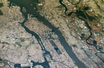 NASA astronaut photograph from the International Space Station of New York City and New Jersey from an oblique angle showing Manhattan the Hudson River New Jersey and the East Rutherford MetLife Stadium area