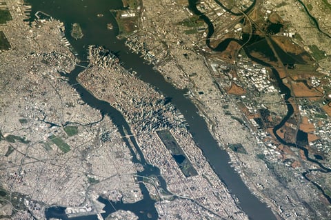 NASA astronaut photograph from the International Space Station of New York City and New Jersey from an oblique angle showing Manhattan the Hudson River New Jersey and the East Rutherford MetLife Stadium area