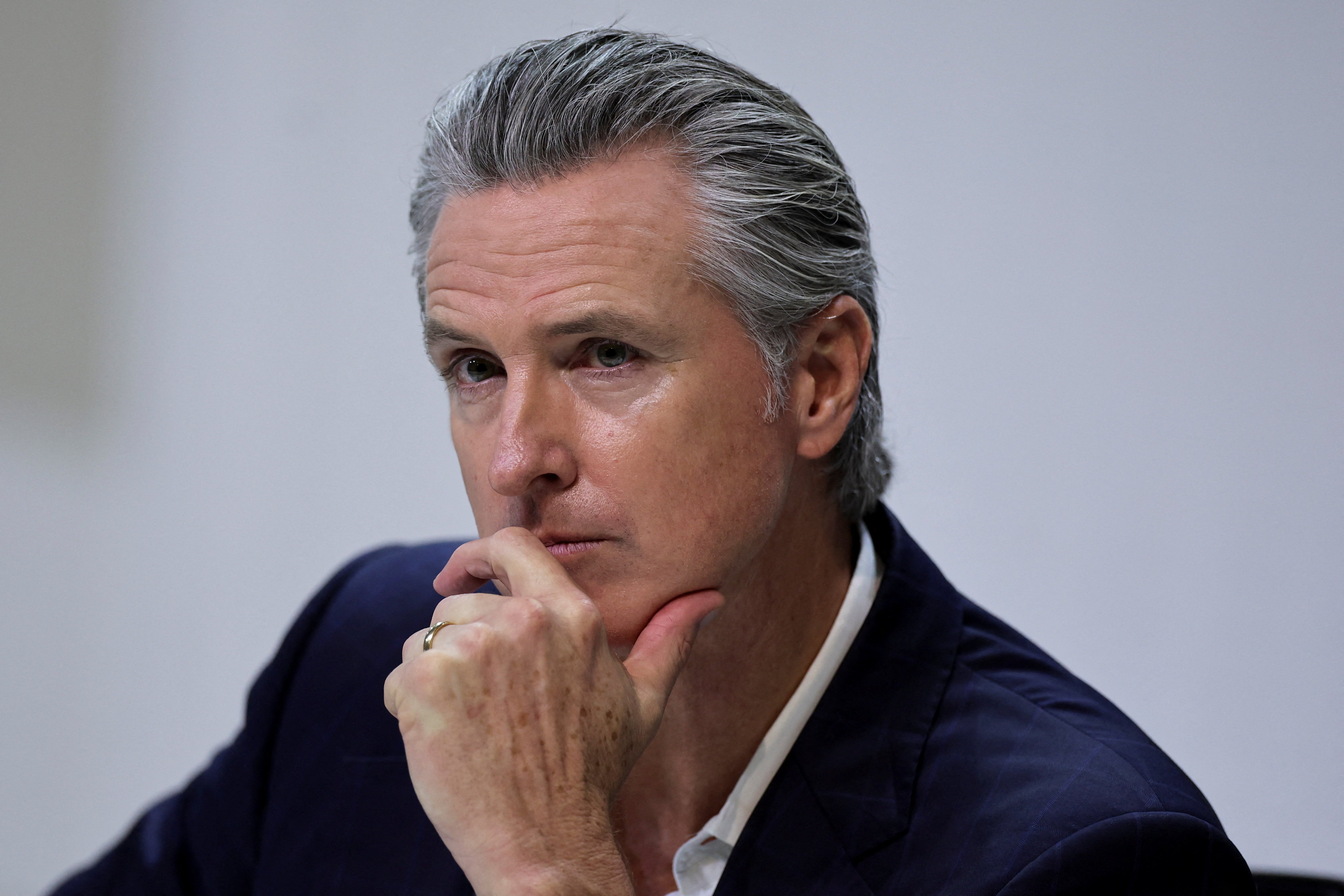 California Governor Gavin Newsom attends a news conference during the UN Climate Change Conference in Belem, Brazil, after Trump-era rollbacks of state emissions rules