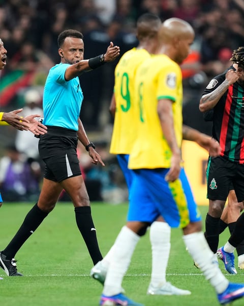Somali referee Omar Artan signals a penalty during the CAF Champions League final in Rabat Morocco
