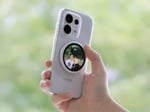 OPPO Bubble circular AMOLED display snapped magnetically to the back of a smartphone