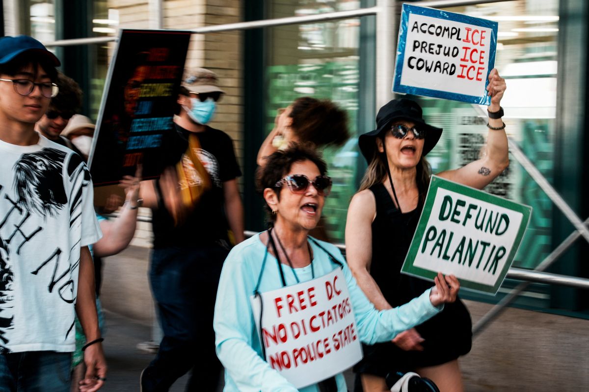 Demonstrators march against Palantir outside its New York offices over its surveillance work
