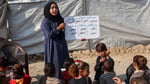 Destroyed school building in Gaza amid rubble from Israeli strikes