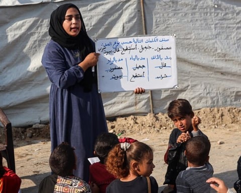 Destroyed school building in Gaza amid rubble from Israeli strikes