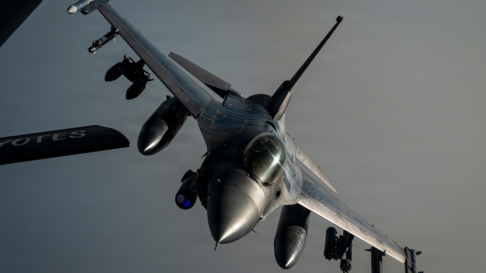US Air Force F-16 Fighting Falcon refueling from KC-135 tanker in CENTCOM area of responsibility as Pentagon faces fuel cost surge from Iran war