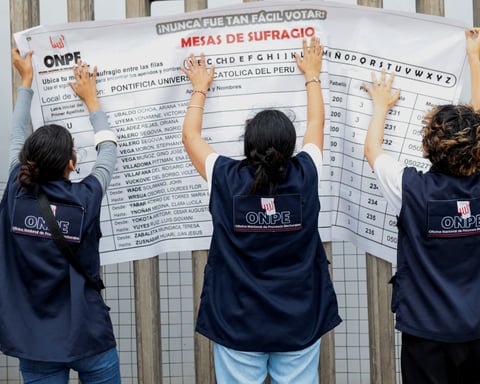 Electoral workers at a polling station in Lima during Peru's 2026 presidential runoff between Keiko Fujimori and Roberto Sanchez