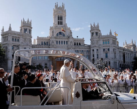Pope Leo XIV waves from the popemobile at Plaza de Cibeles, Madrid, for Corpus Christi Mass June 2026