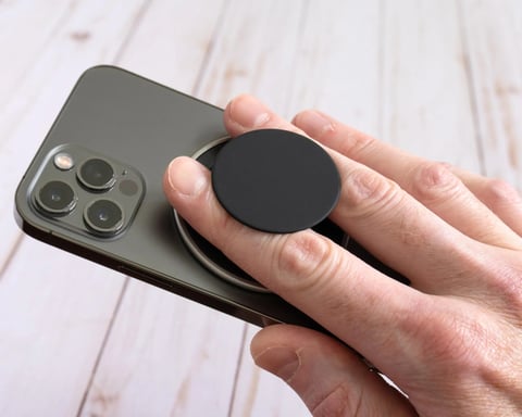 PopSockets Low-Pro Grip attached to an iPhone showcasing its ultra-thin MagSafe-compatible design