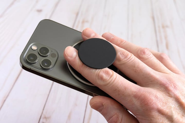 PopSockets Low-Pro Grip attached to an iPhone showcasing its ultra-thin MagSafe-compatible design