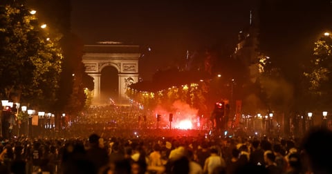 PSG fans gather on the Champs-Elysees in Paris after Champions League win over Arsenal in Budapest