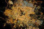 NASA astronaut photograph of Riyadh Saudi Arabia at night from the International Space Station showing the brightly illuminated capital radiating along ring roads from a glowing central business district