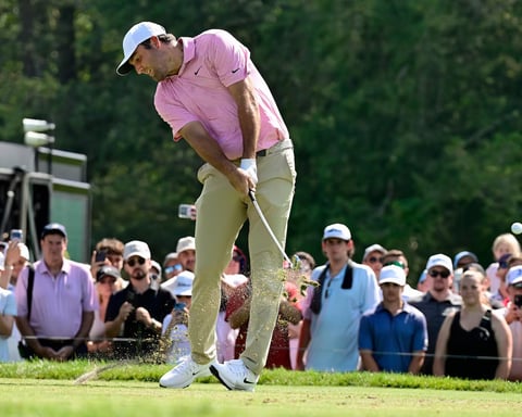 Scottie Scheffler reacts after holing par putt on 18th hole to force Monday sudden-death playoff at 2026 Travelers Championship TPC River Highlands