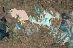 NASA Landsat 5 Thematic Mapper natural-color satellite image of the Sivash salt lagoons between the Black Sea and the Sea of Azov showing the narrow Perekop Isthmus that connects Crimea to mainland Ukraine and the Armiansk bridge corridor