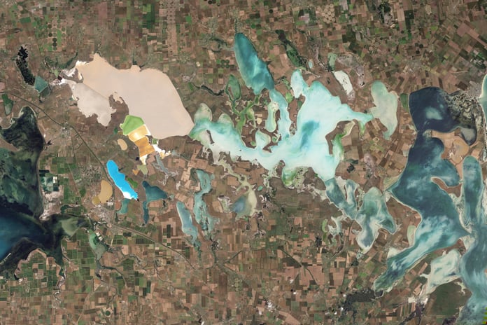 NASA Landsat 5 Thematic Mapper natural-color satellite image of the Sivash salt lagoons between the Black Sea and the Sea of Azov showing the narrow Perekop Isthmus that connects Crimea to mainland Ukraine and the Armiansk bridge corridor