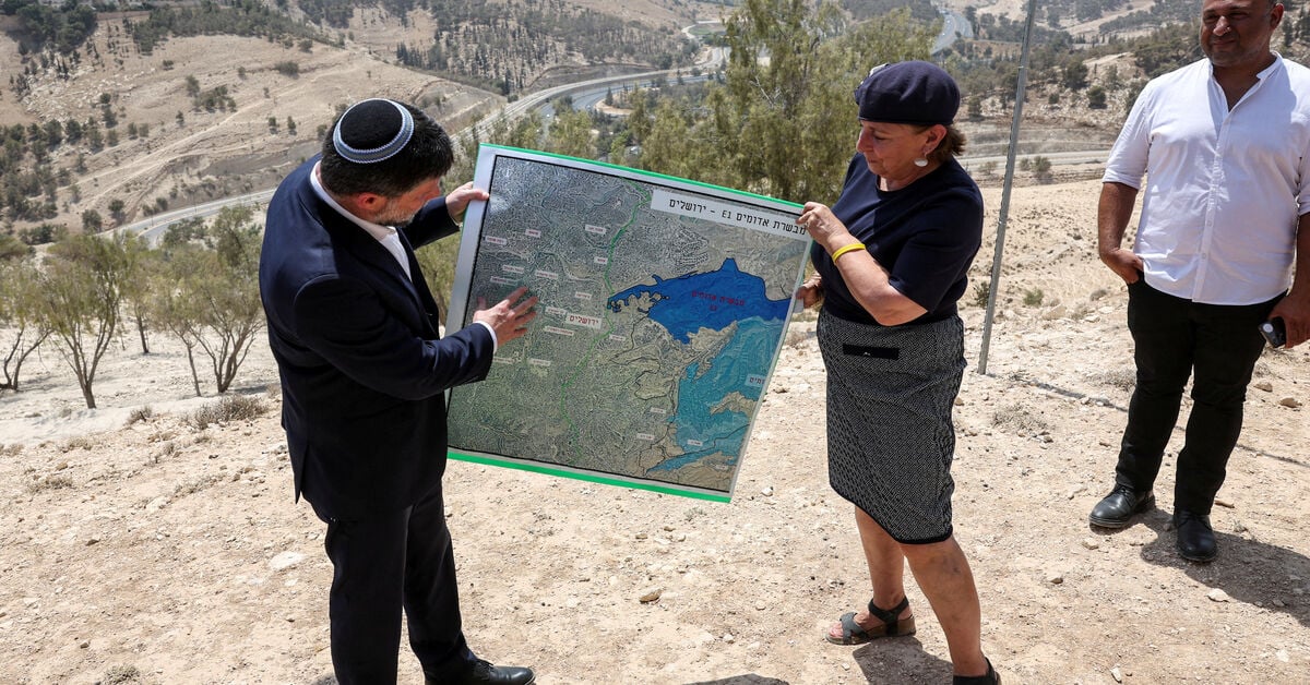 Israeli Finance Minister Bezalel Smotrich holds map of E1 settlement scheme near Maale Adumim in occupied West Bank