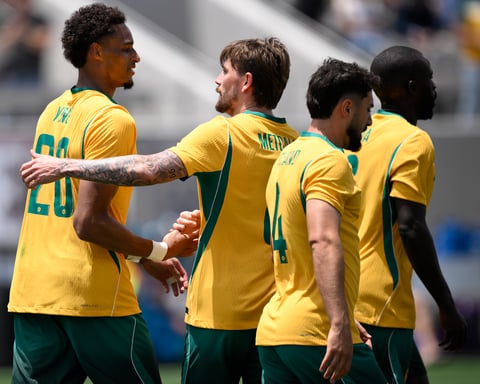 Tete Yengi of Australia celebrates with teammates after scoring on debut against Switzerland at Snapdragon Stadium, San Diego, June 6 2026